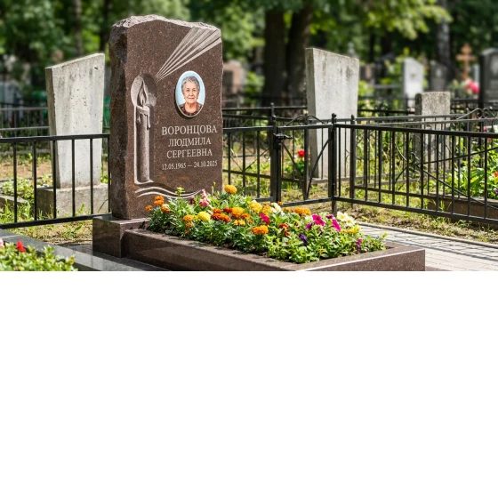 Памятник с резной свечой и лучом света из дымовского гранита